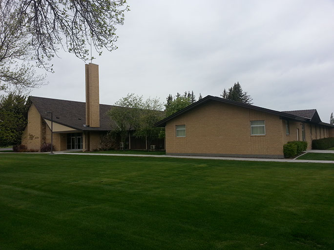 LDS Chapel with grass yard and brown brick