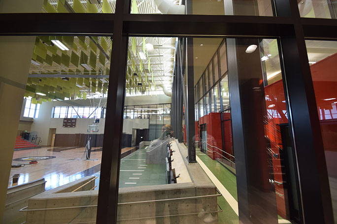 C. Mark Openshaw Education Center and Office Building gym area view through curtain wall