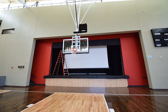 C. Mark Openshaw Education Center and Office Building stage and basketball hoop