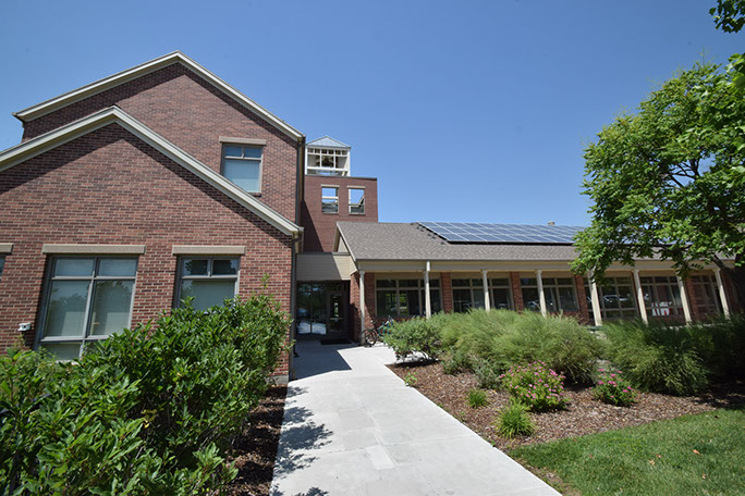 Rowland Hall-St. Mark's School entrance with trees and landscaping