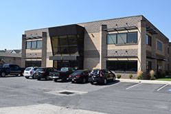 West Coast Holdings officebuilding front entrance with glass atrium