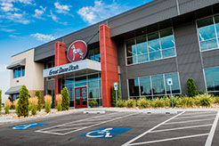 Great Dane Trailers office front entrance with parking stalls and landscaping