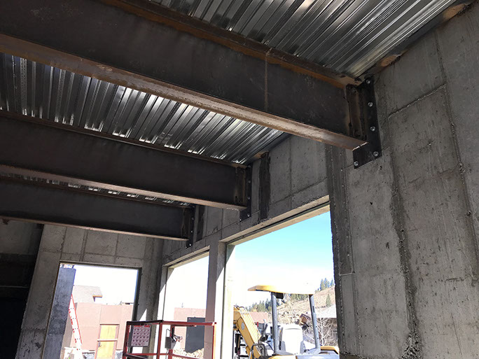 Stein Eriksen Lodge Expansion concrete beam over openings with steel framing above