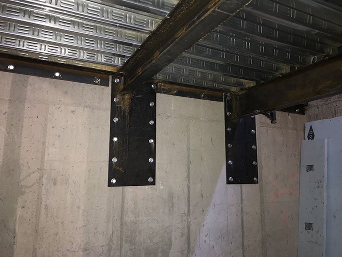 Stein Eriksen Lodge Expansion post installed plates in concrete wall