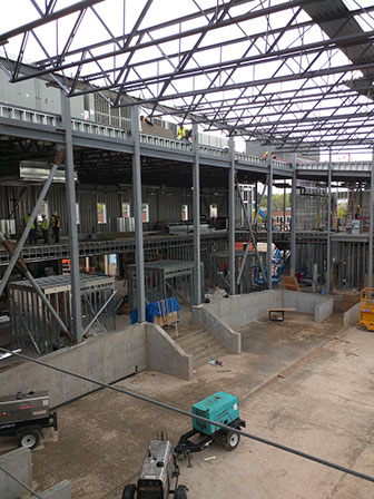 C. Mark Openshaw Education Center gym area with roof structure and braces