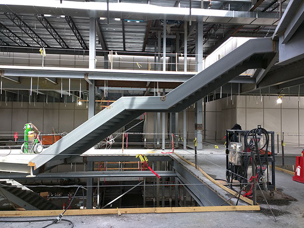 Brigham Young University Harman Building Addition atrium floating stairs under construction
