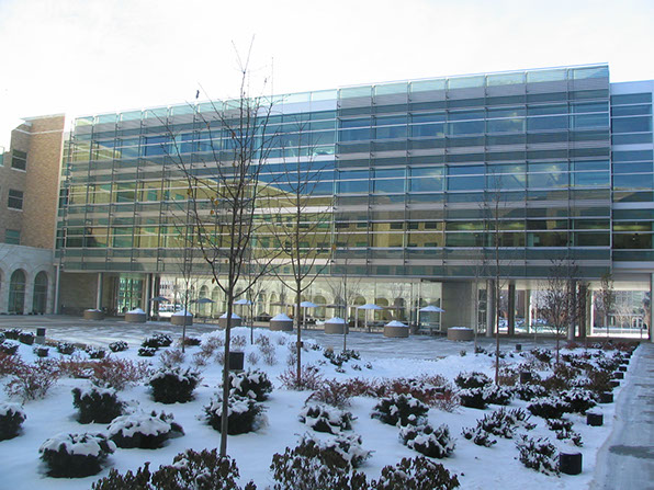 BYU Joseph F. Smith Building courtyard facing glass facade with snow