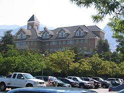 BYU Gordon B. Hinckley Alumni Center with tress in foreground
