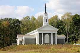 Priesthood restoration site chapel with forest in the background