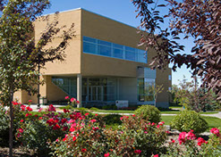 BYU-Idaho Thomas E. Ricks Building with flowers and trees in foreground